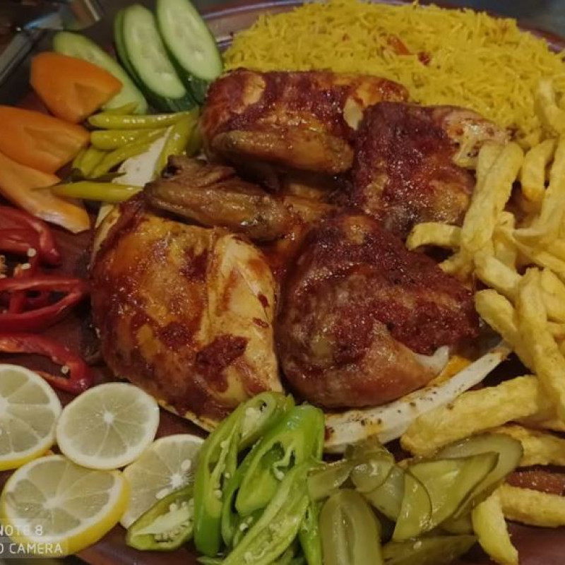 Half A Chicken Grilled On Gas With Garlic And Pickles, And Potatoes/Rice